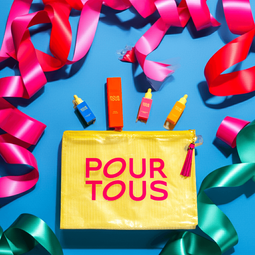 Colorful cosmetic products with ribbons and yellow pouch on blue background