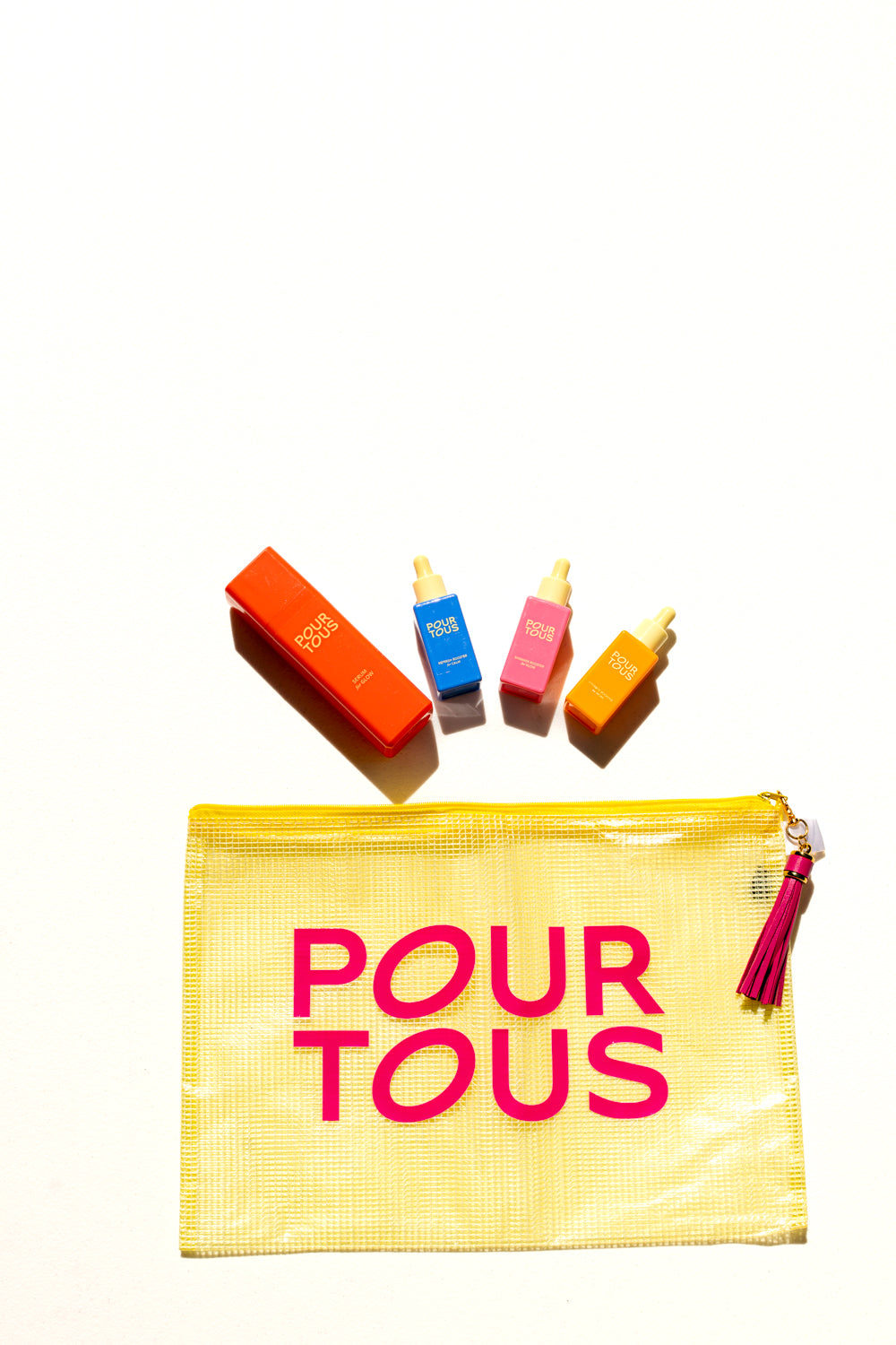yellow pouch with pour tous skincare products