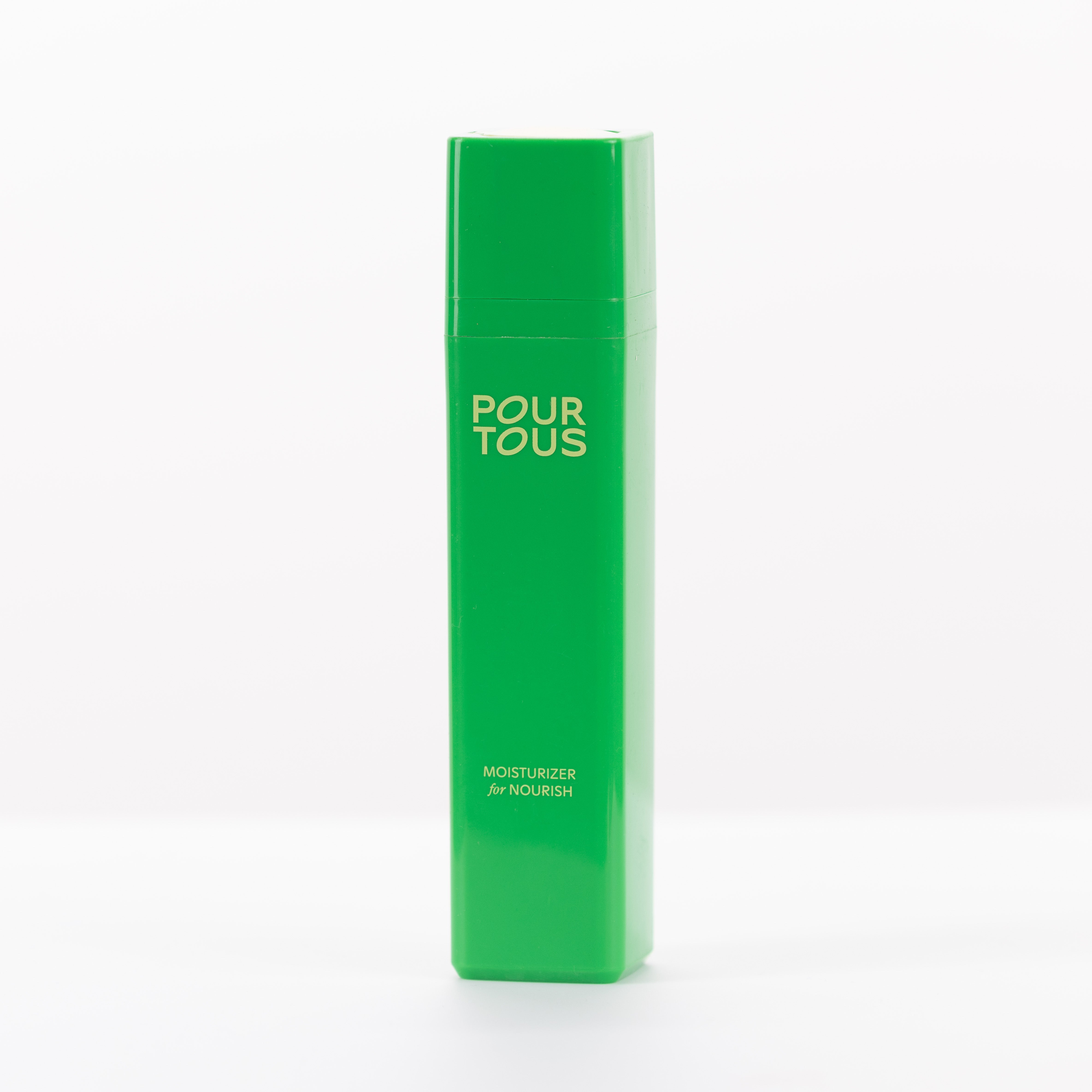 Green bottle of Pour Tous moisturizer for nourish